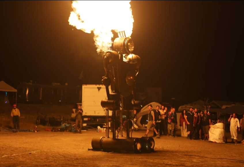robot with flames above it
