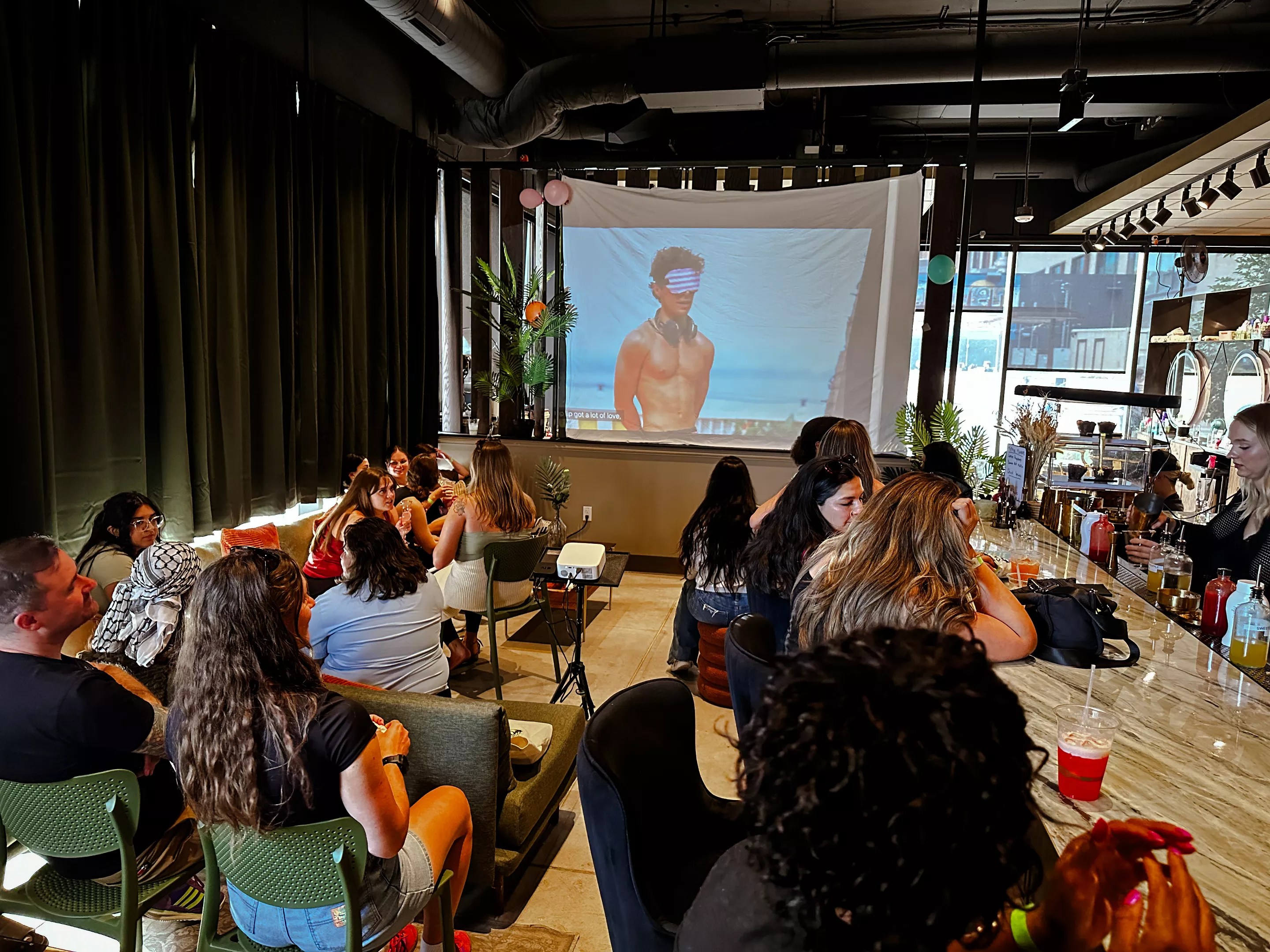 People watch Love Island on a big screen