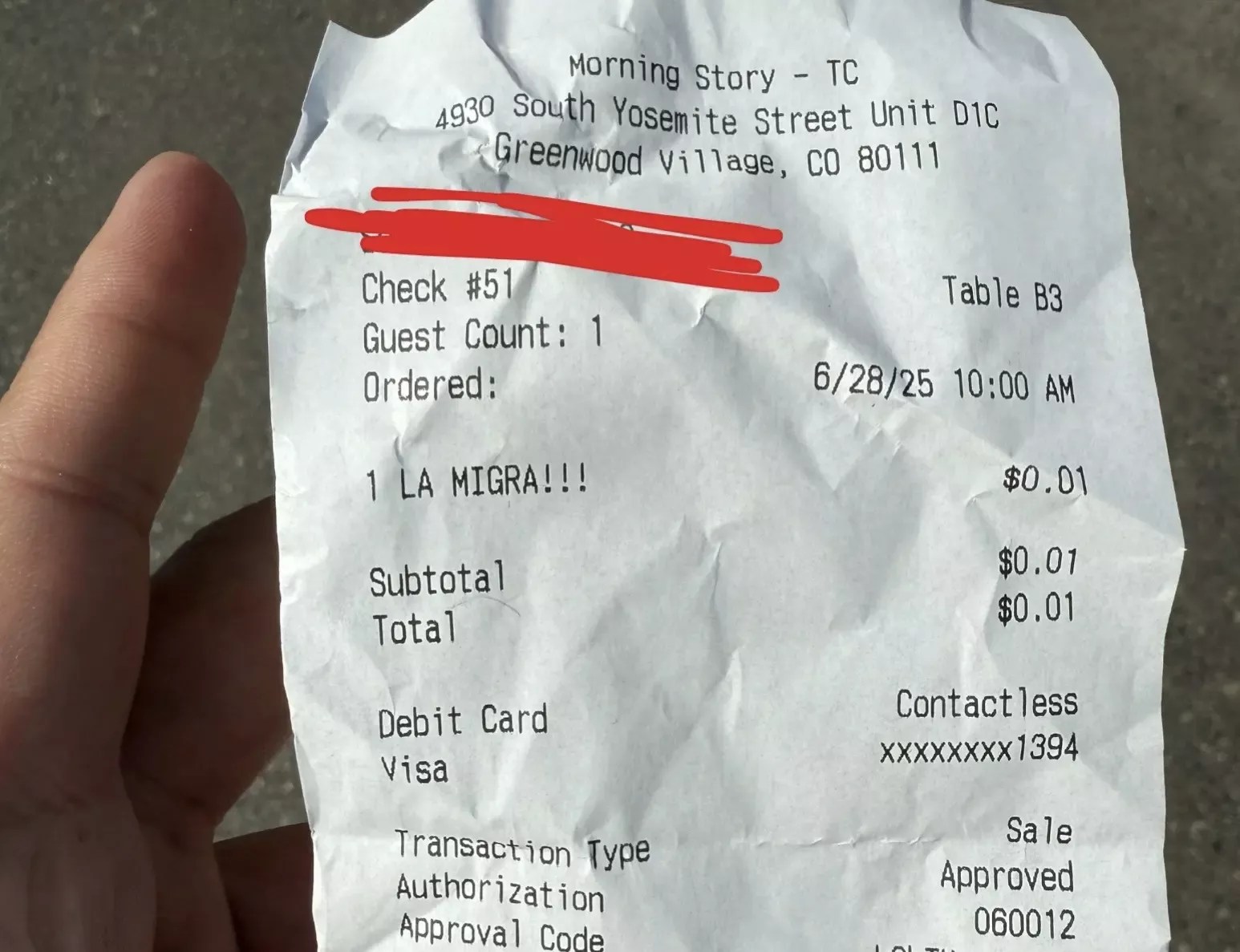 A piece of receipt paper with a charge stating "La Migra!!!"