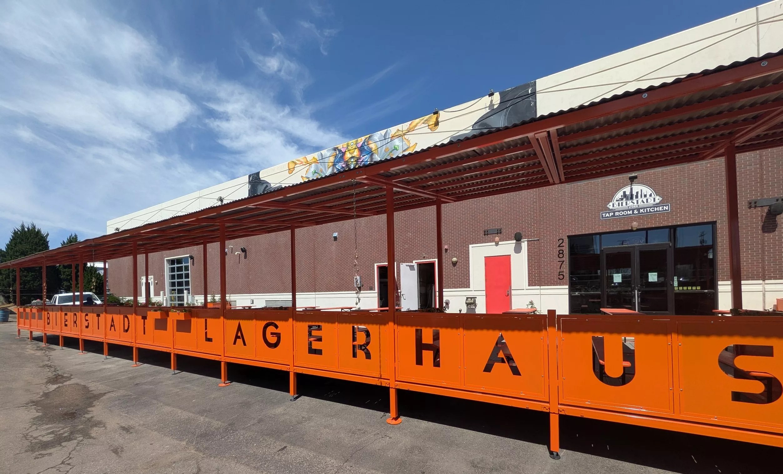 Covered patio with orange metal work.