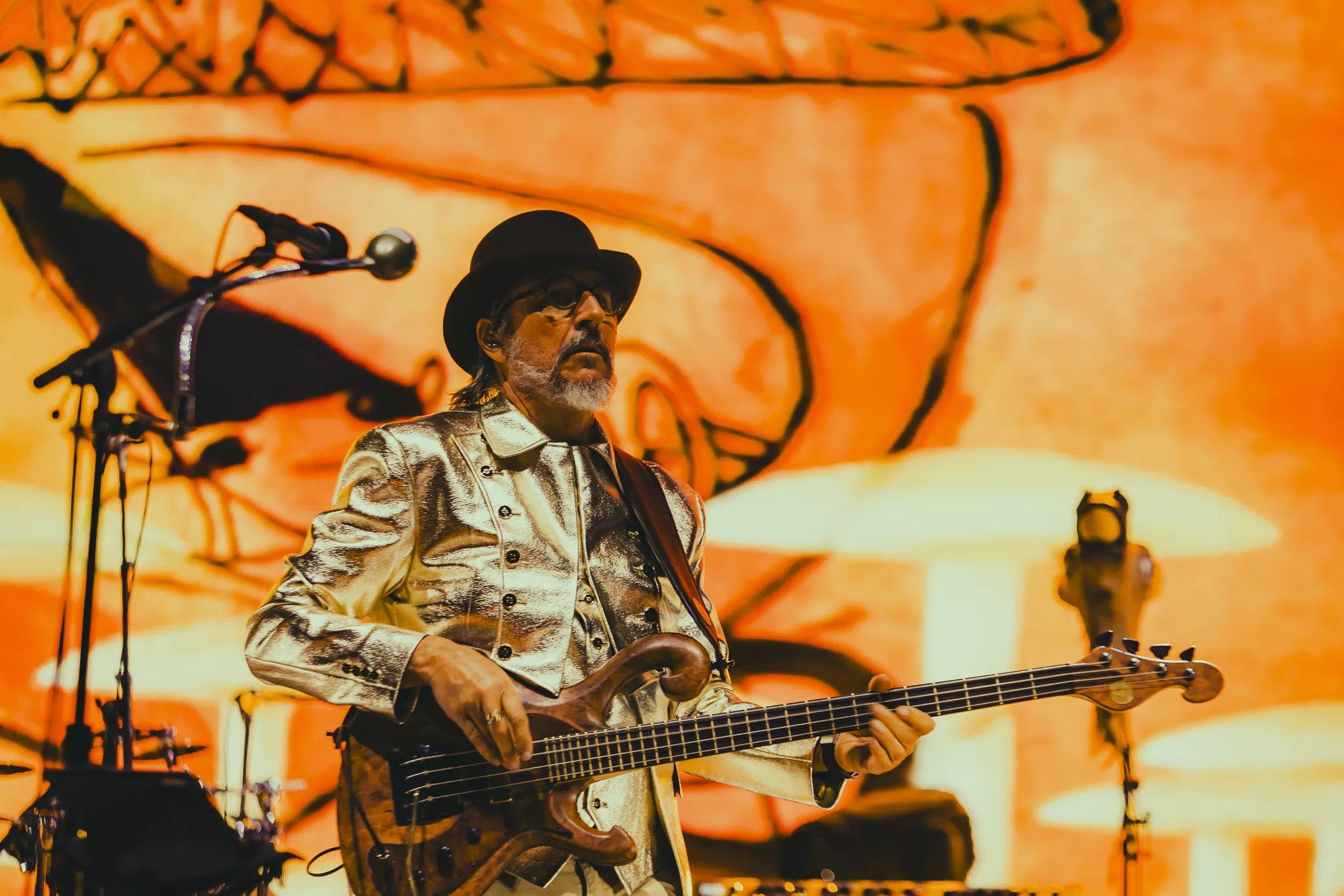 Les Claypool performing on stage at Red Rocks.