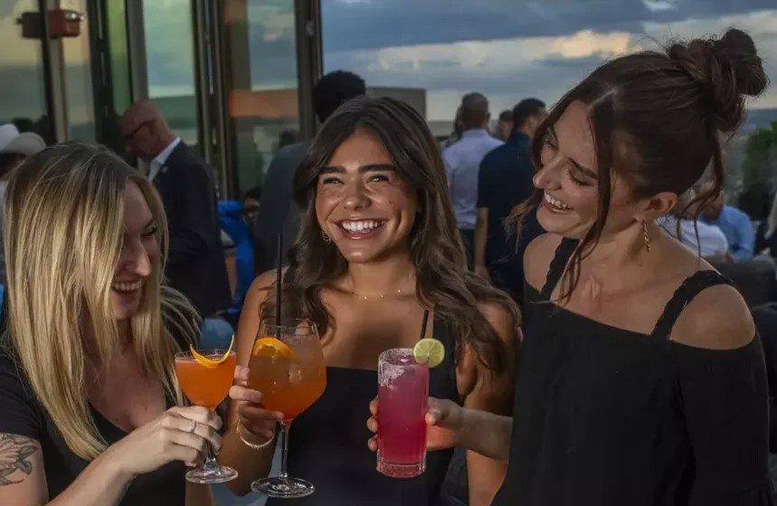 three women on rooftop deck