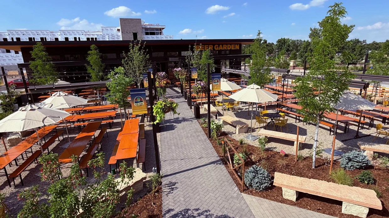Large beer garden with plants.
