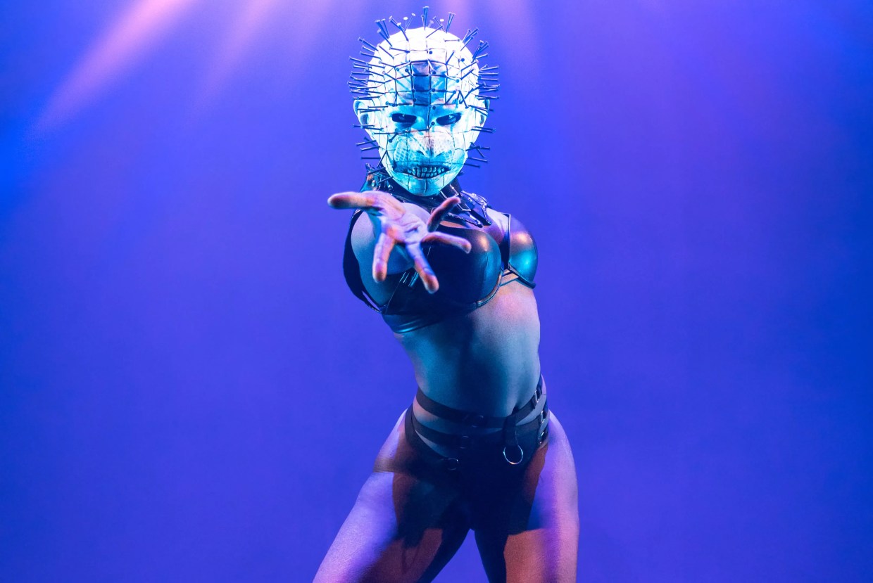 a performer in a mask