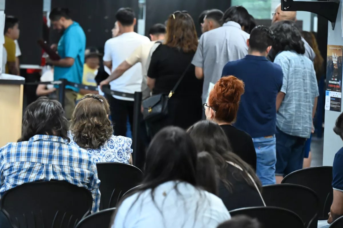 People wait at a consulate.
