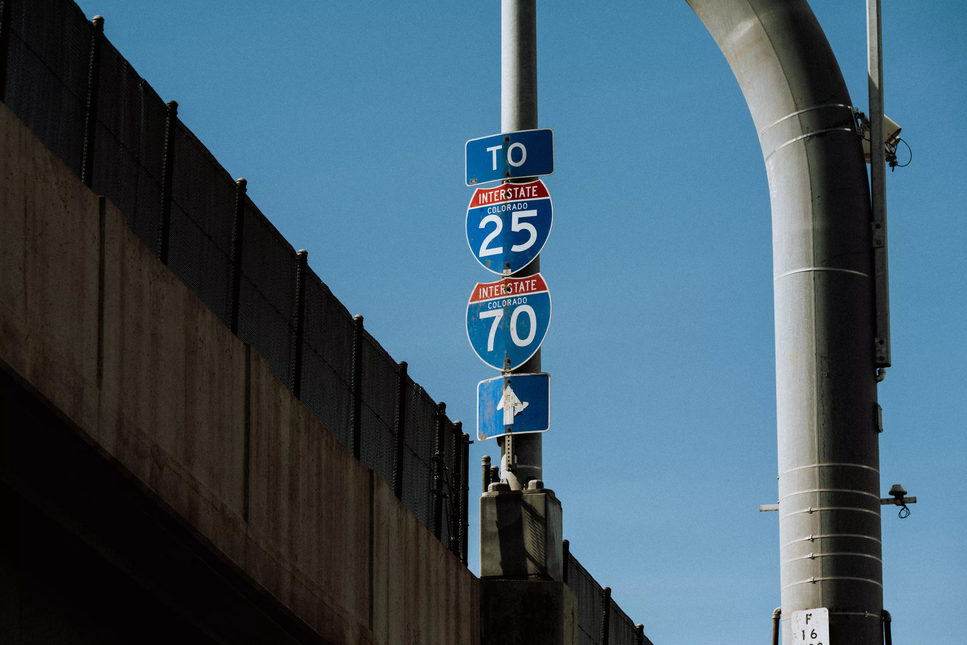 highway signs in Denver for I-25 and I-70