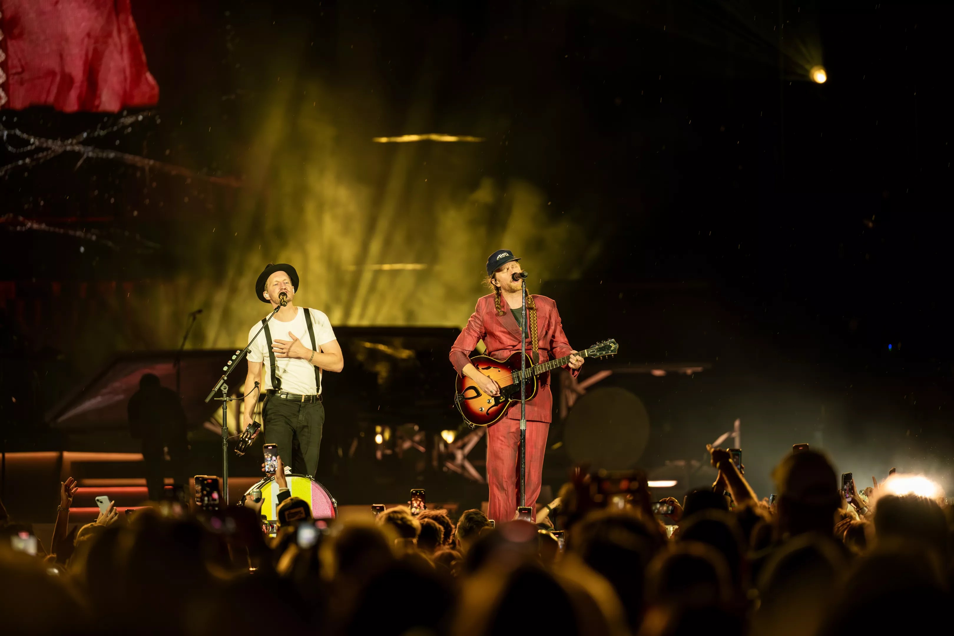 The Lumineers on stage at Empower Field