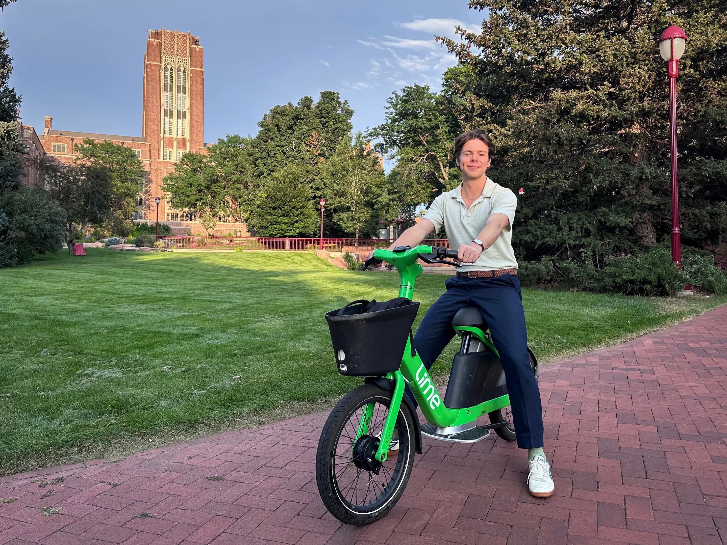 College student sits on e-bike