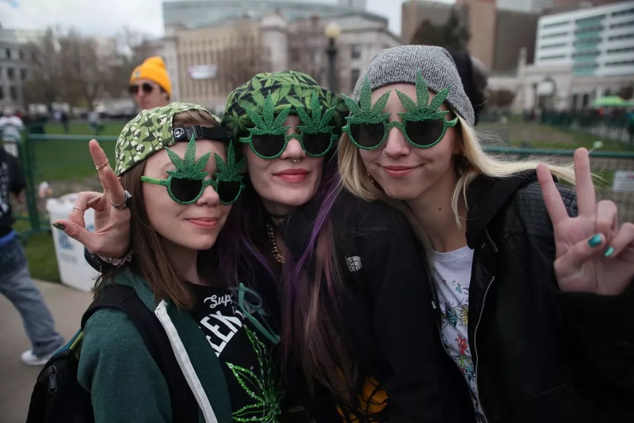 women wearing marijuana leaf sunglasses