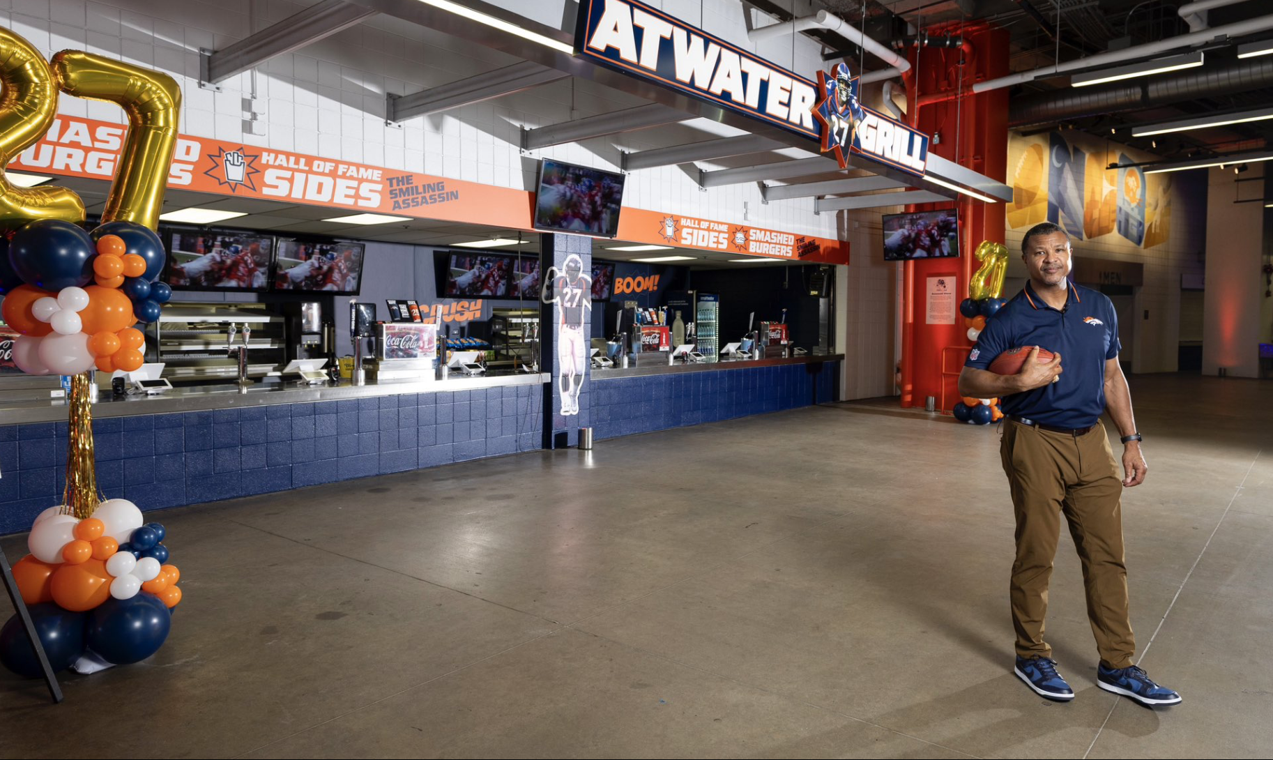 football player in front of food counter