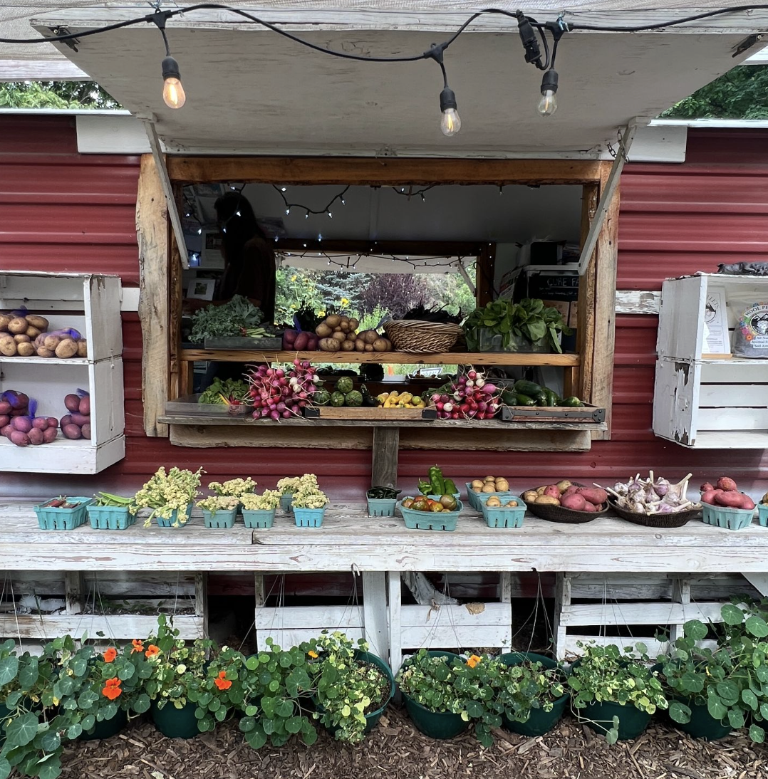 A farm stand with fruits and vegetables