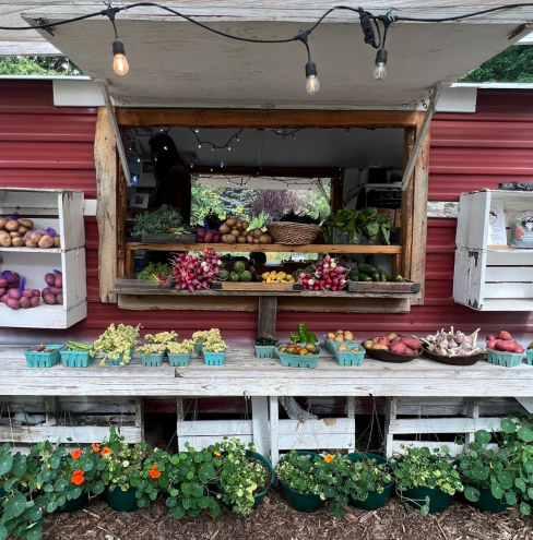 A farm stand with fruits and vegetables